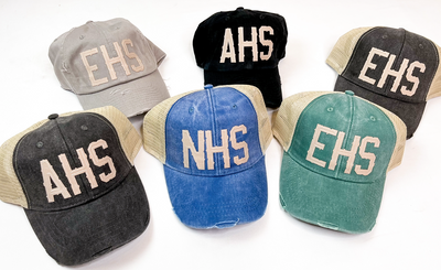 Back to Front L-R: Light Gray Solid, Black Solid, Black Trucker, Black Trucker, Royal Trucker, Green Trucker